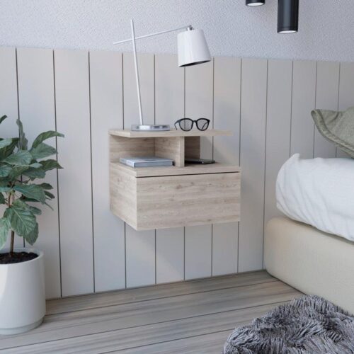 Aprovecha la oferta de esta mesa de noche flotante en color jerez es el mueble perfecto para quienes buscan optimizar el espacio en su dormitorio sin comprometer el estilo. Su diseño moderno y minimalista, junto con su cajón sin tirador y sus dos divisiones inferiores, proporciona una solución funcional y estética para organizar y decorar tu habitación.