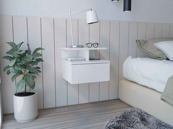 Aprovecha la oferta de La mesa de noche flotante en color blanco es el mueble perfecto para quienes buscan optimizar el espacio en su dormitorio sin comprometer el estilo. Su diseño moderno y minimalista, junto con su cajón sin tirador y sus dos divisiones inferiores, proporciona una solución funcional y estética para organizar y decorar tu habitación.