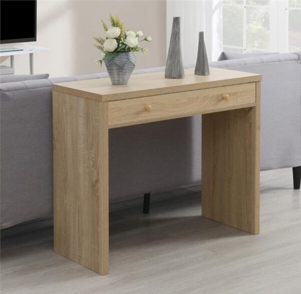 Aprovecha la oferta de La mesa consola en color roble con un amplio cajón y tiradores de madera es la elección perfecta para quienes buscan un mueble que combine diseño, funcionalidad y calidad. Sus medidas de 76 cm de alto, 91 cm de ancho y 40 cm de profundidad la hacen ideal para adaptarse a cualquier espacio, desde la entrada de tu hogar hasta la sala de estar o el dormitorio.