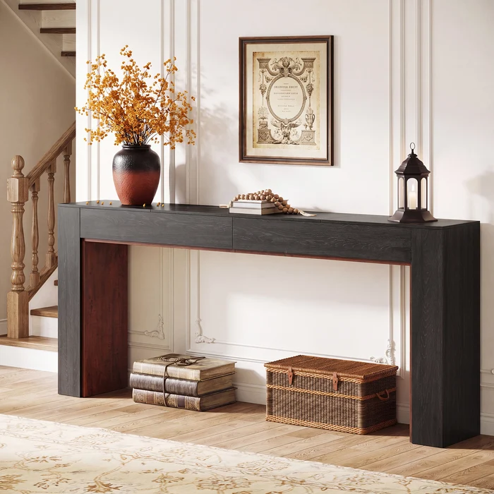 Mesa Consola Moderna en Roble: Elegancia y Funcionalidad para tu Hogar Transforma tu espacio con la mesa consola moderna en color roble, una pieza de mobiliario que combina estilo, funcionalidad y calidad. Esta mesa consola no solo sirve como un atractivo elemento decorativo, sino que también ofrece un espacio de almacenamiento práctico. Confeccionada en melamina de alta calidad de 18 mm, garantiza durabilidad y resistencia. Las medidas de este elegante mueble son 85 cm de alto, 200 cm de ancho y 35 cm de profundidad, ideales para embellecer y organizar cualquier área de tu hogar. Beneficios y Cualidades 1. Diseño Moderno y Sofisticado: La mesa consola en color roble negro destaca por su diseño contemporáneo que se adapta a diversos estilos de decoración, desde modernos hasta más clásicos. Su acabado le otorga una calidez natural que crea un ambiente acogedor en cualquier estancia.